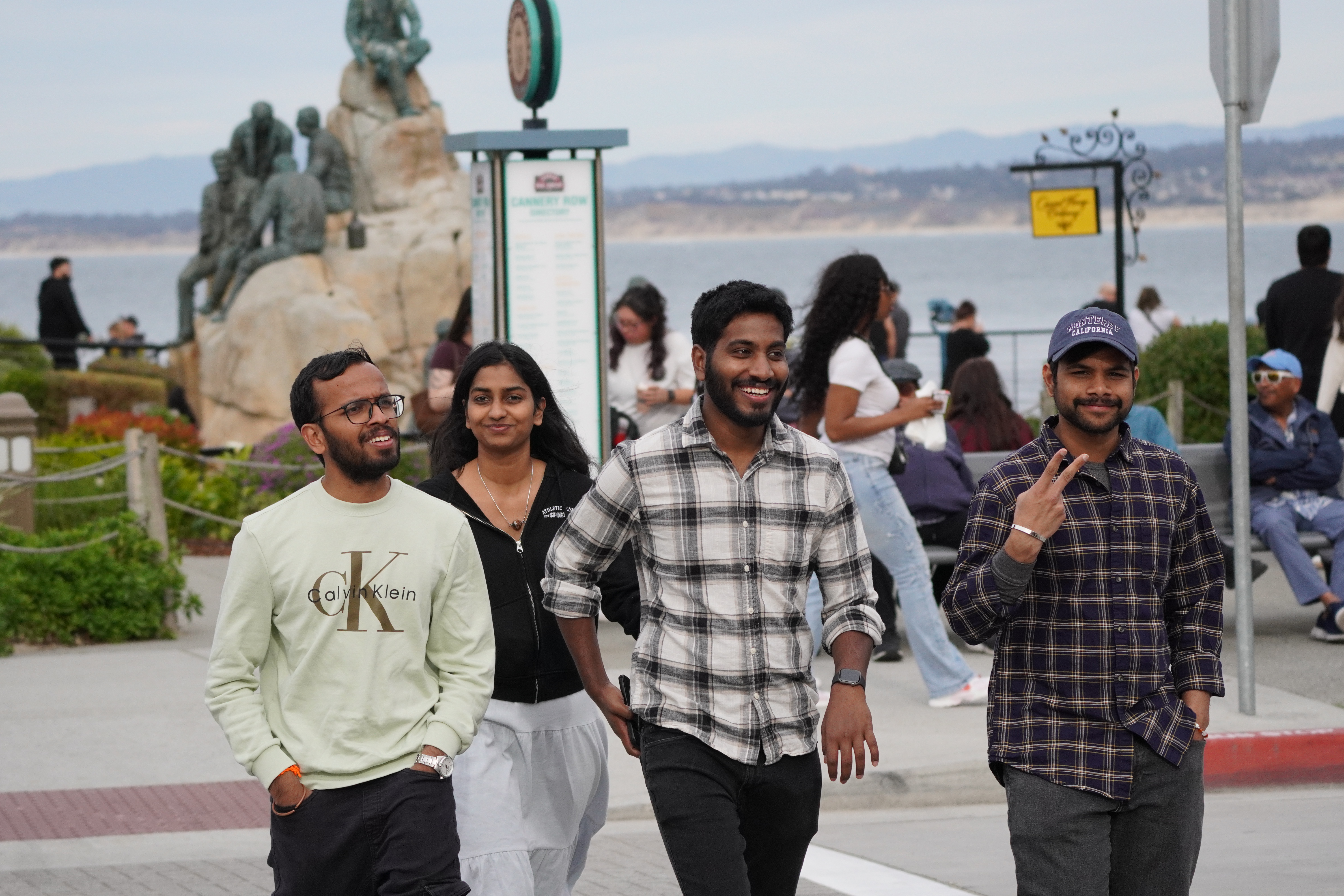 Group portrait of friends walking together near the waterfront